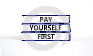 Pay yourself first symbol. Concept words Pay yourself first on beautiful books. Beautiful white table white background. Business