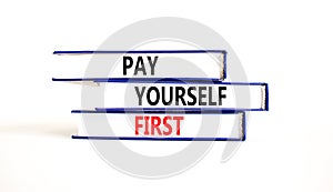 Pay yourself first symbol. Concept words Pay yourself first on beautiful books. Beautiful white table white background. Business