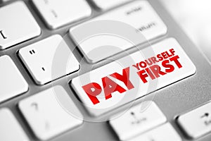 Pay Yourself First text button on keyboard, concept background photo