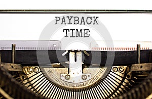 Payback time symbol. Concept words Payback time typed on old retro typewriter. Beautiful white background. Business and payback