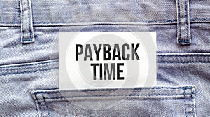 PAYBACK TIME words on a white paper stuck out from jeans pocket. Business concept