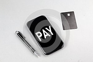 PAYBACK TIME is written in white notepad near a calculator, clipboard and pen. Business concept