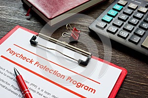 Paycheck Protection Program PPP loan application form and pen.