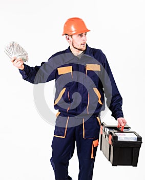 Payday concept. Man with toolbox got salary, money for work.