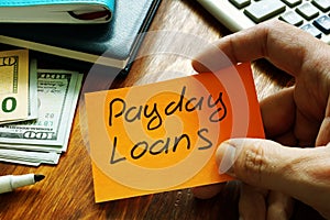 Payday loans written on a piece of paper