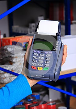 Paying with credit card in an electrical shop, finance concept