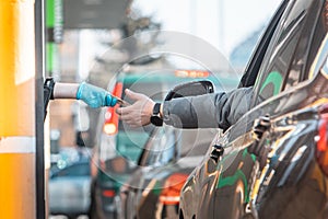 paying for fast food from the car at drive-through