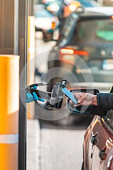 paying for fast food from the car at drive-through