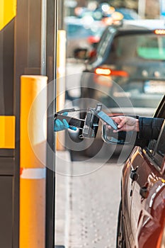 paying for fast food from the car at drive-through