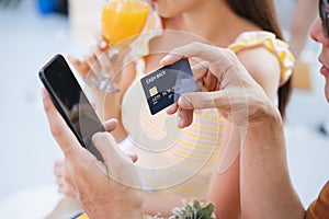 Paying for hotel booking with smartphone and credit card