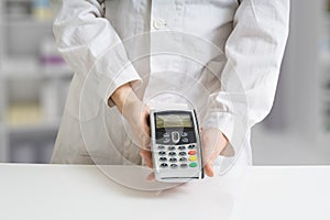 Paying with payment terminal in pharmacy