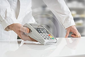 Paying with payment terminal in pharmacy