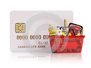 Paying for shopping basket full of grocery products with credit card. Online food ordering and delivery service concept