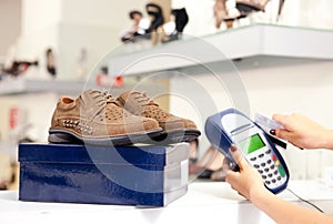 Paying using credit card terminal in shoe store