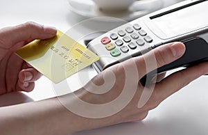 Payment in cafe concept with card and terminal on white background