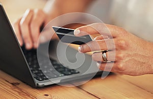 Payment, credit card and hands with a laptop for online shopping, banking and finance. Ecommerce, retail and person