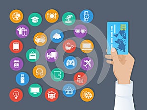 Payment by credit card. System of cashless payments for services and goods. Hand holds a credit card and set of service icons.