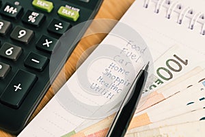 Payment and expense calculation concept, pen on list numbers of