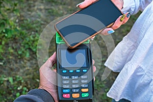 Payment with an NFC-enabled smartphone.