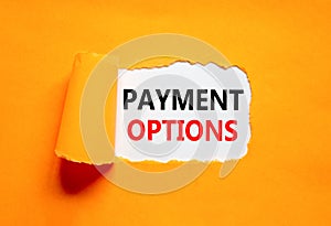 Payment options symbol. Concept words Payment options on beautiful white paper. Beautiful orange background. Business payment