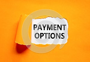Payment options symbol. Concept words Payment options on beautiful white paper. Beautiful orange background. Business payment