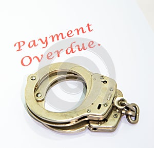 Payment overdue warning and handcuffs.