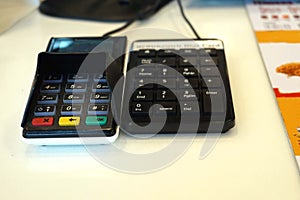 A payment point with credit card reader and keypad for service a customers