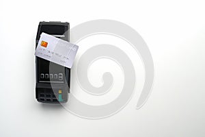 Payment terminal and credit card  on white background.