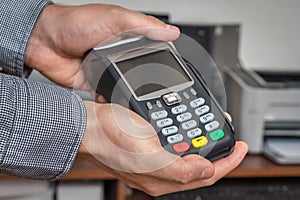 Payment terminal in hand