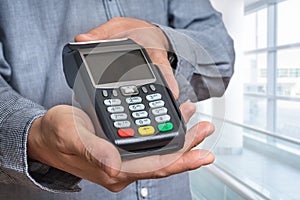 Payment terminal in hand of man