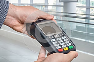 Payment terminal in hand of man