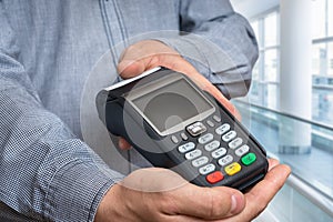 Payment terminal in hand of man
