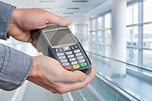 Payment terminal in hand of man