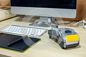 Payment terminal with intuos draw and computer screen on desk