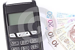 Payment terminal with polish currency money on white background, paying for shopping, finance concept