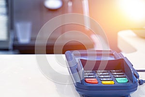 Payment terminal on table in restaurant. Financial concept