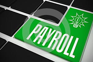 Payroll on black keyboard with green key