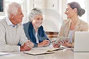 It pays to plan properly for the future. Cropped shot of a senior couple getting advice from their financial consultant.