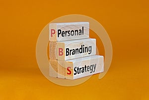 PBS, Personal branding strategy symbol. Concept words PBS, Personal branding strategy on wooden blocks on a beautiful orange photo
