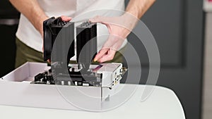 PC Cooler in Computer Motherboard. Repairman or Technician Works in Electronics Workshop or Hardware Service.
