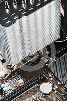 PC CPU cooler with heat pipes installed on mainboard