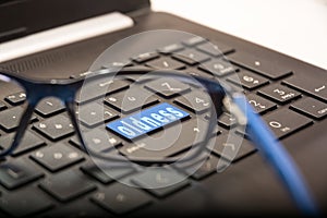 PC key with the written Presbyopia seen through the glasses