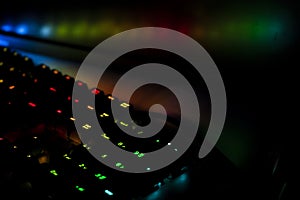 PC RGB keyboard in a dark gameroom or convention setting photo