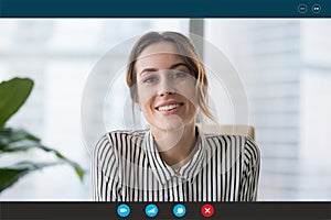 Pc screen view headshot businesswoman makes videocall looks at webcam photo