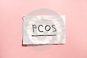 PCOS - Polycystic ovary syndrome, woman sickness lettering on pink background