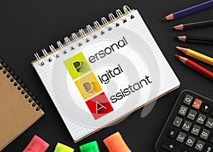 PDA - Personal Digital Assistant acronym on notepad, technology concept background