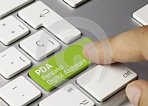 PDA Personal Digital Assistant - Inscription on Green Keyboard Key