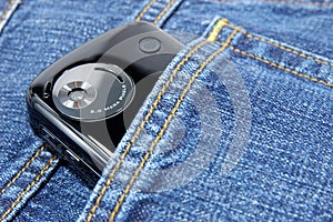 Pda phone in blue jeans pocket