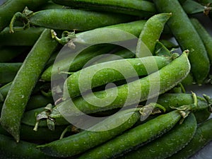 Pea pods with water drops.