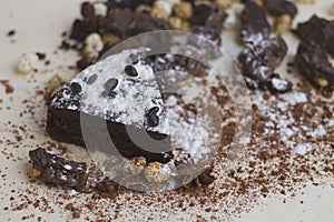 Peace of chocolate cake with candies and cinnamon